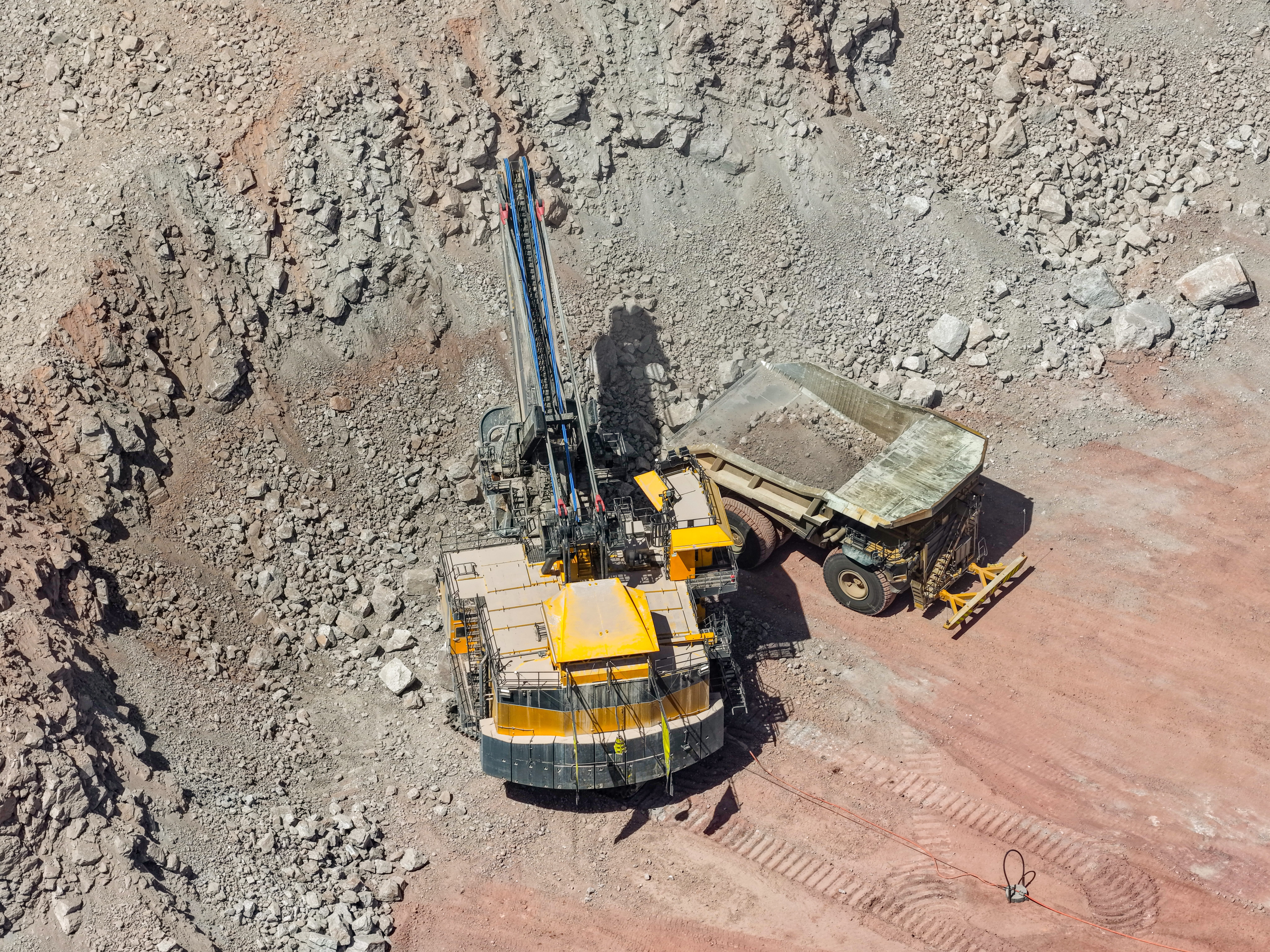 Machinery excavating materials from the bottom of a quarry