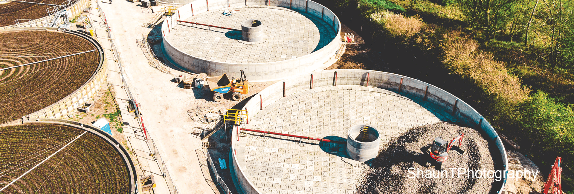 Water filtration plant being constructed with a yellow tipper